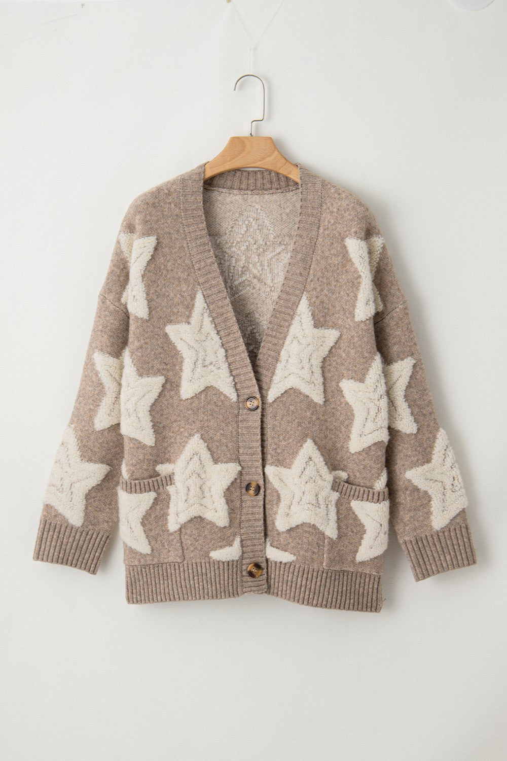 Mocha cardigan with cream star pattern and button-up front, long sleeves