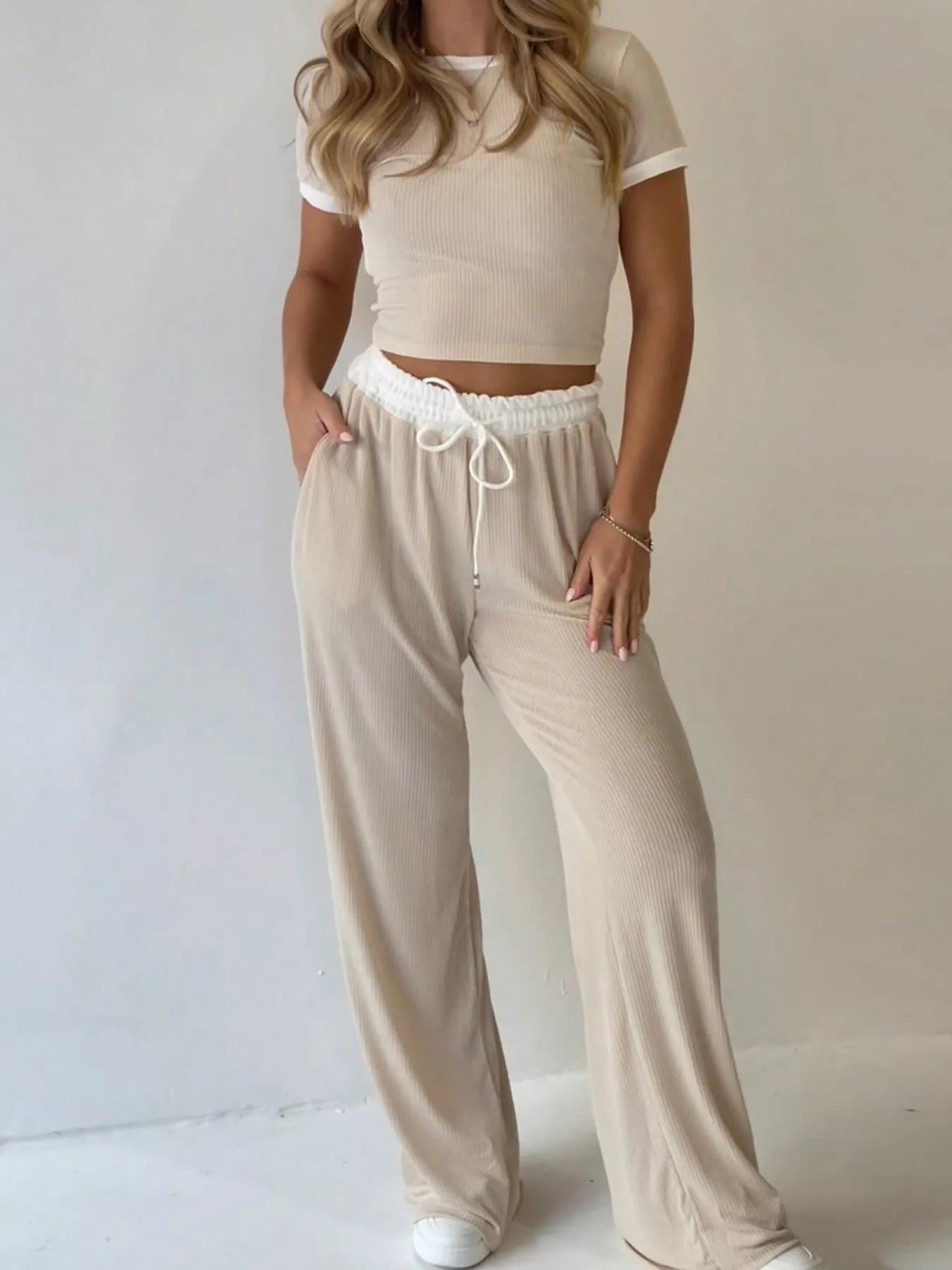 Beige contrast trim crop top and wide-leg pants set, front view