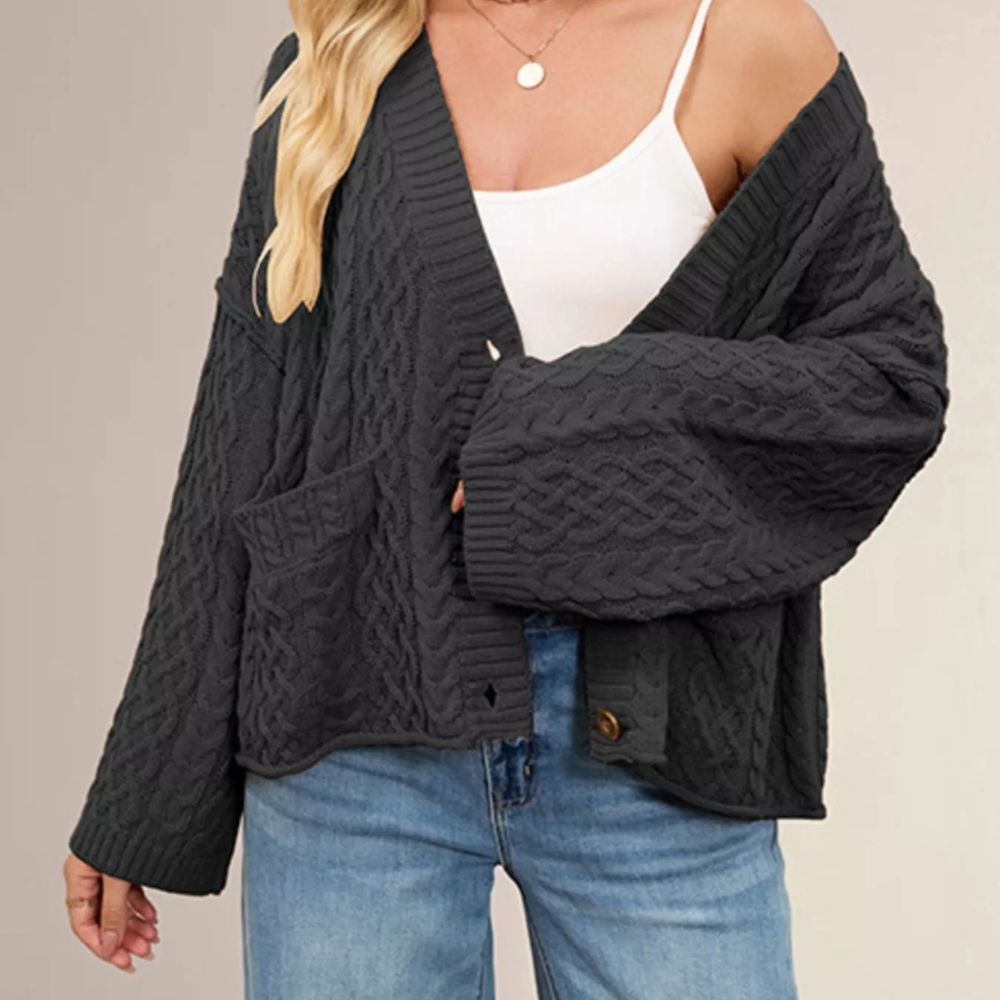 Black cable knit cardigan, wears on white top