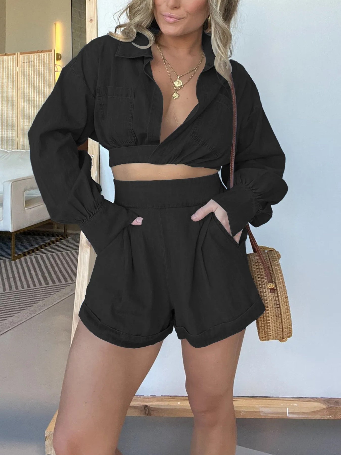 Blue long sleeve denim crop top and matching shorts two-piece set, worn with top tied at front