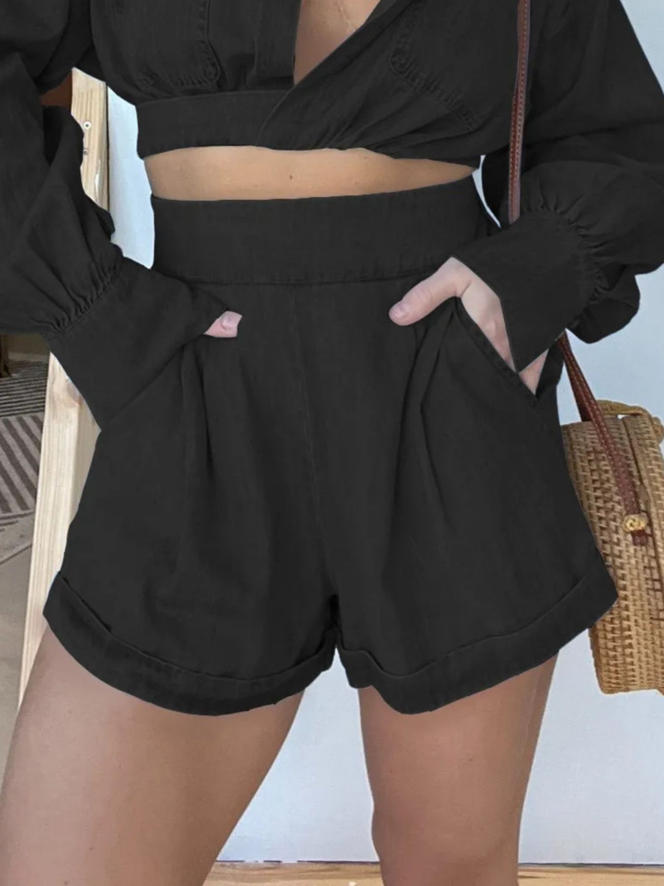 Blue long sleeve denim crop top and matching shorts two-piece set, worn with top tied at front