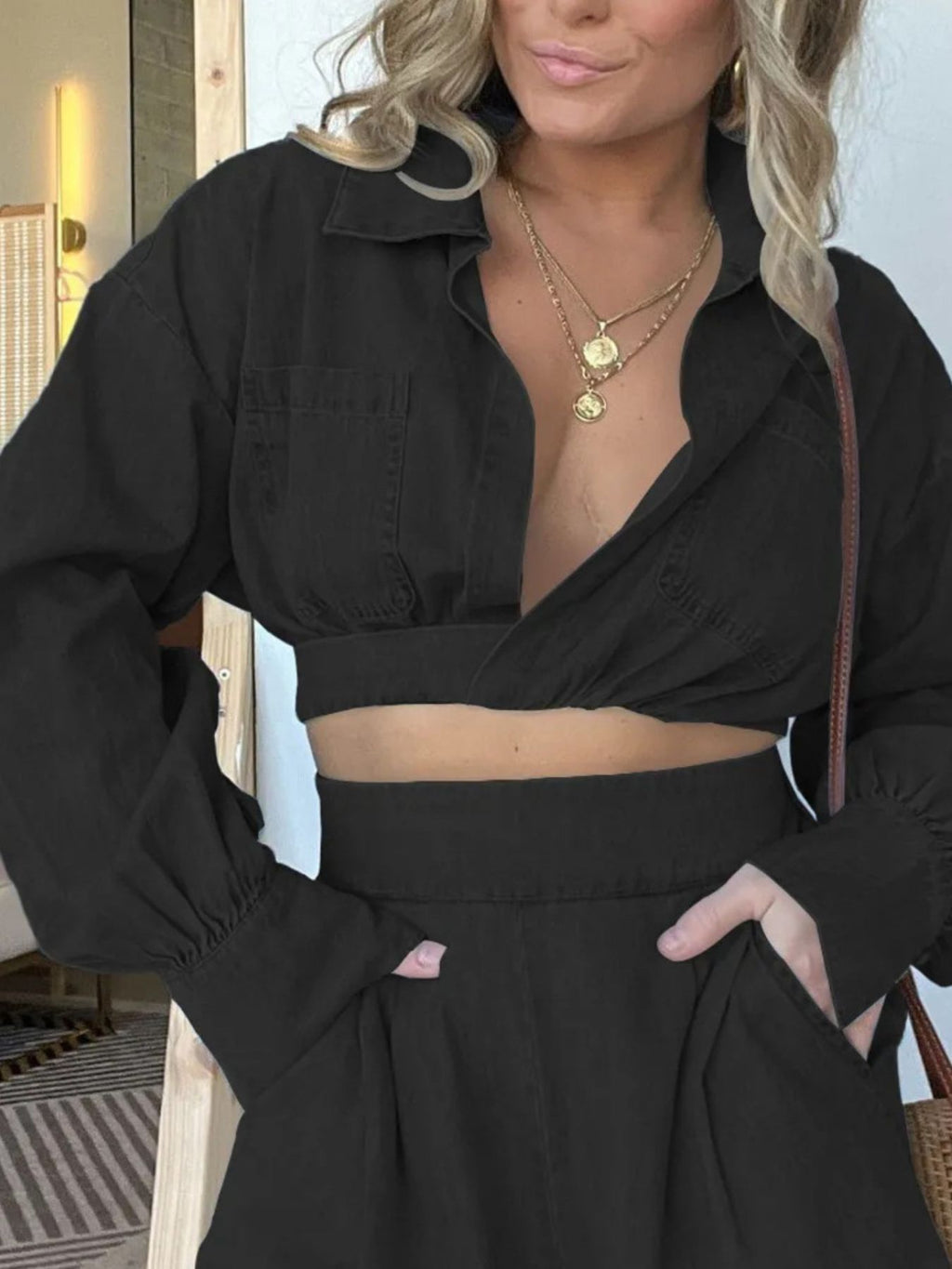 Blue long sleeve denim crop top and matching shorts two-piece set, worn with top tied at front