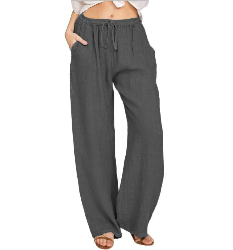 Gray wide-leg pants worn by a person on a white background