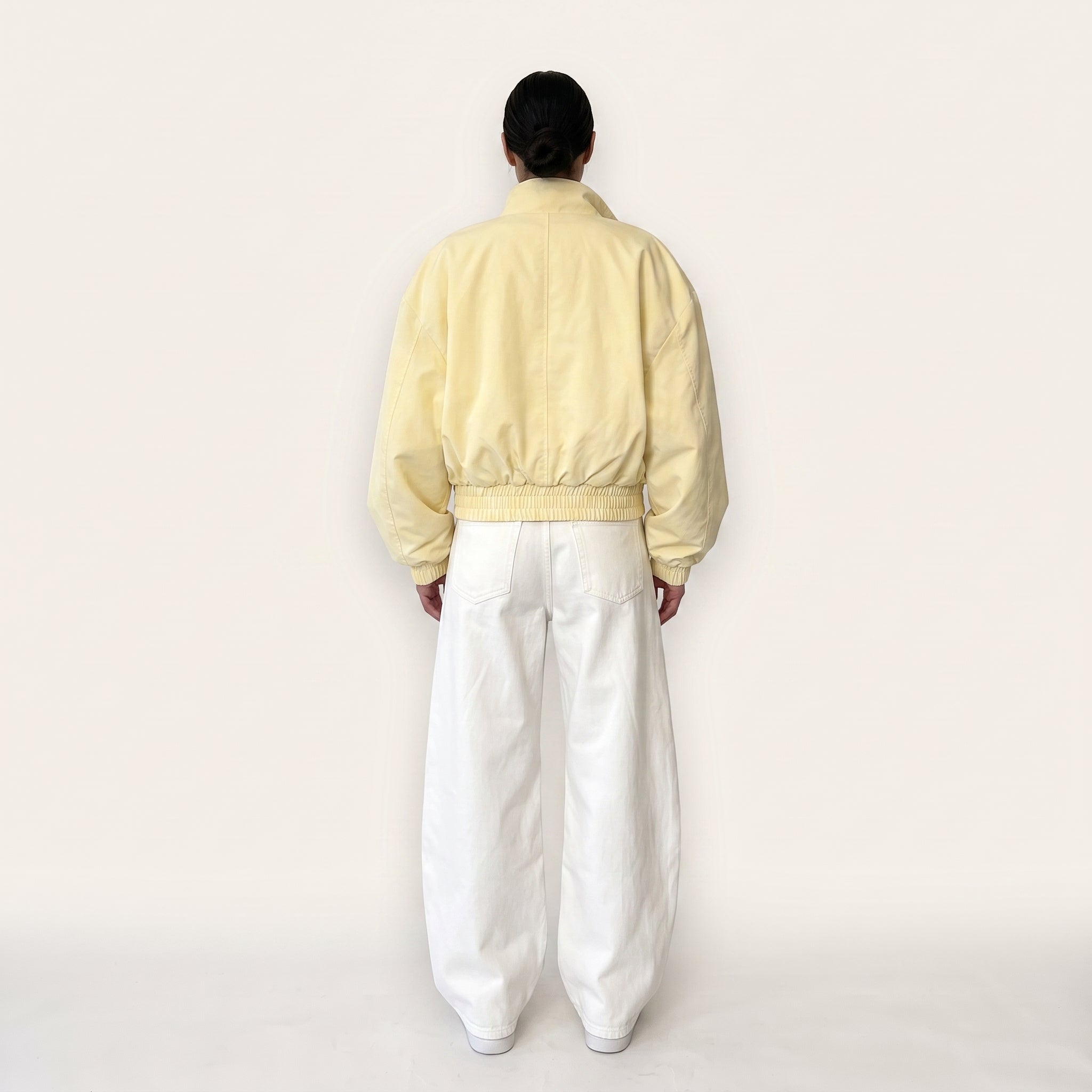 Pastel yellow oversized bomber jacket, back view
