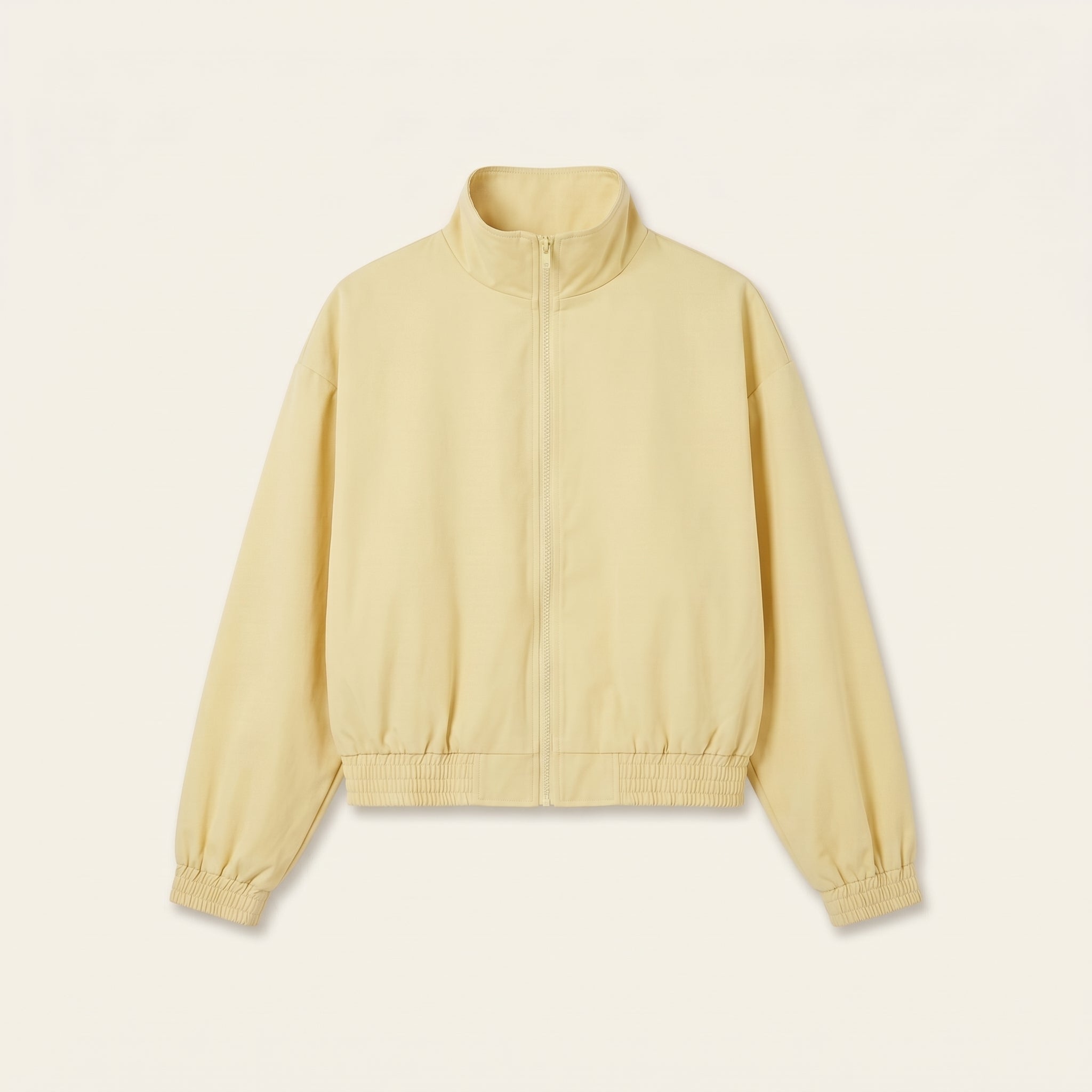 Pastel yellow oversized bomber jacket, front view