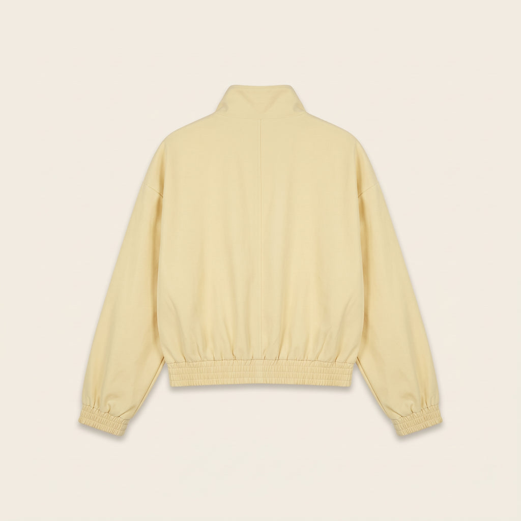 Pastel yellow oversized bomber jacket, back view