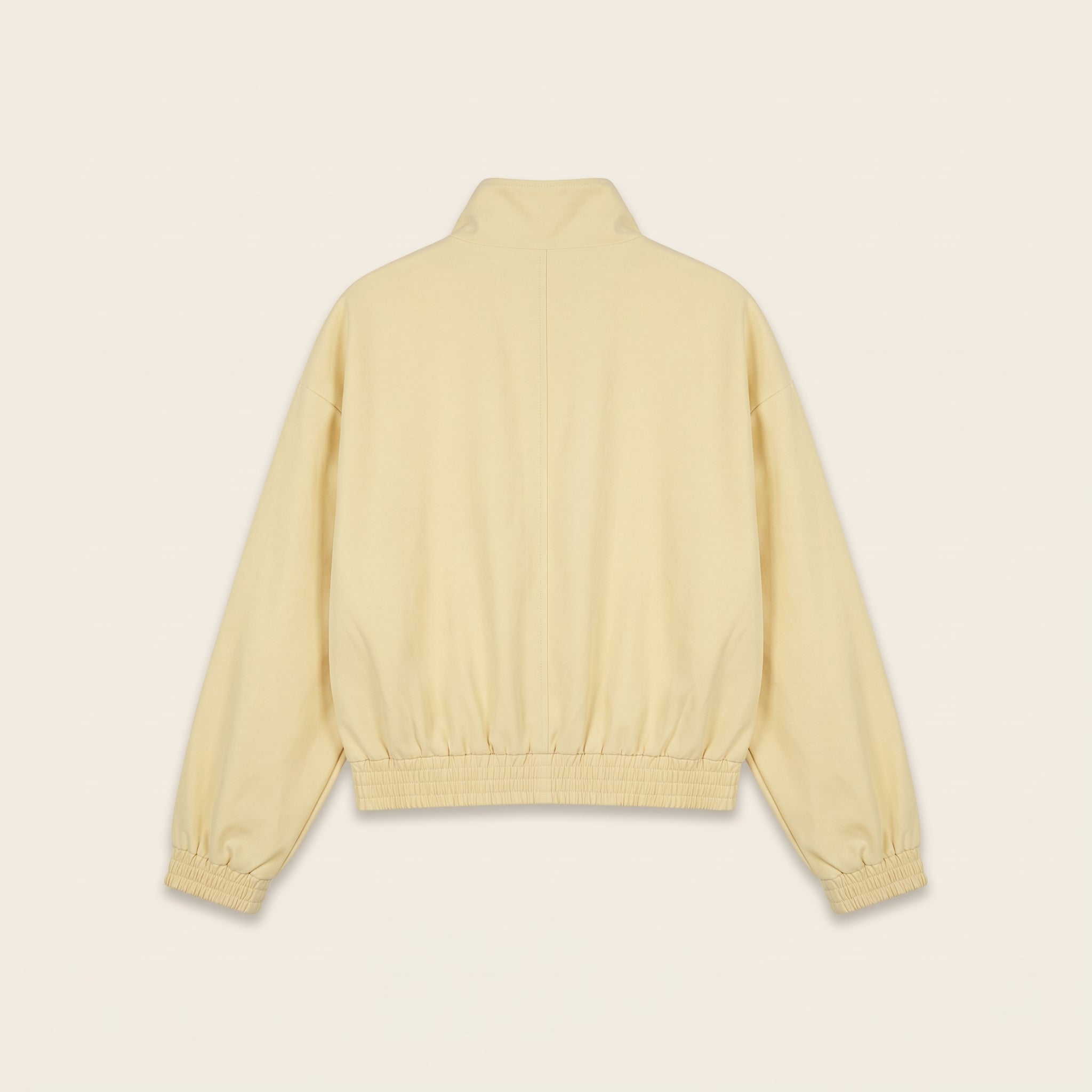 Pastel yellow oversized bomber jacket, back view