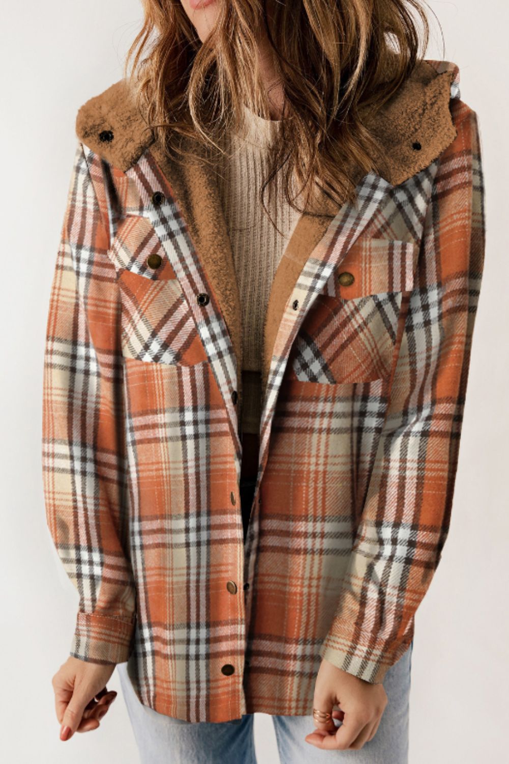 Multicolor plaid button-up shacket with sherpa-lined hood, worn open over a cream sweater