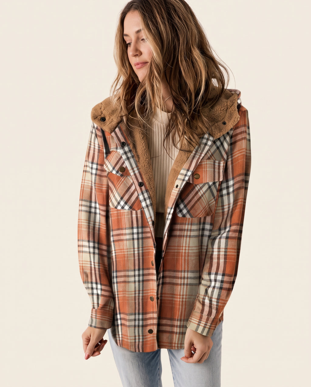 Multicolor plaid button-up shacket with sherpa-lined hood, worn open over a cream sweater