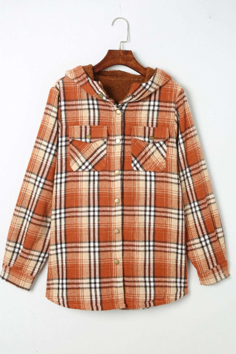 Multicolor plaid button-up shacket with sherpa-lined hood, worn open over a cream sweater