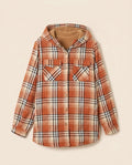 Multicolor plaid button-up shacket with sherpa-lined hood, worn open over a cream sweater
