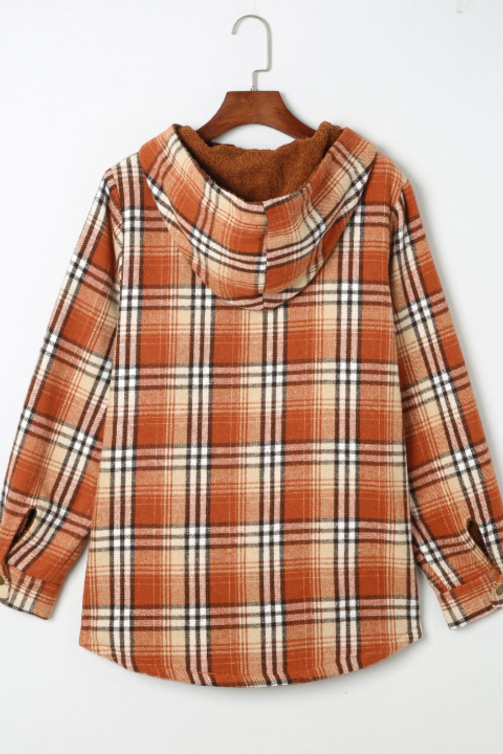 Multicolor plaid button-up shacket with sherpa-lined hood, worn open over a cream sweater