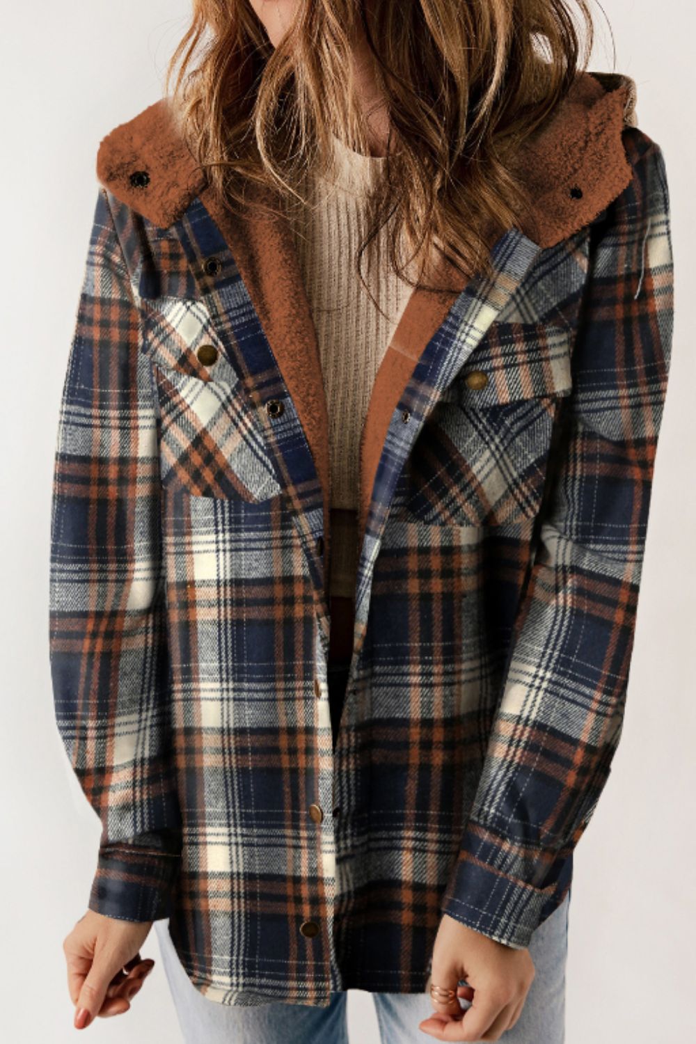 Multicolor plaid button-up shacket with sherpa-lined hood, worn open over a cream sweater