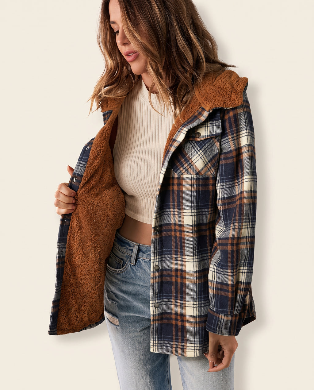 Multicolor plaid button-up shacket with sherpa-lined hood, worn open over a cream sweater