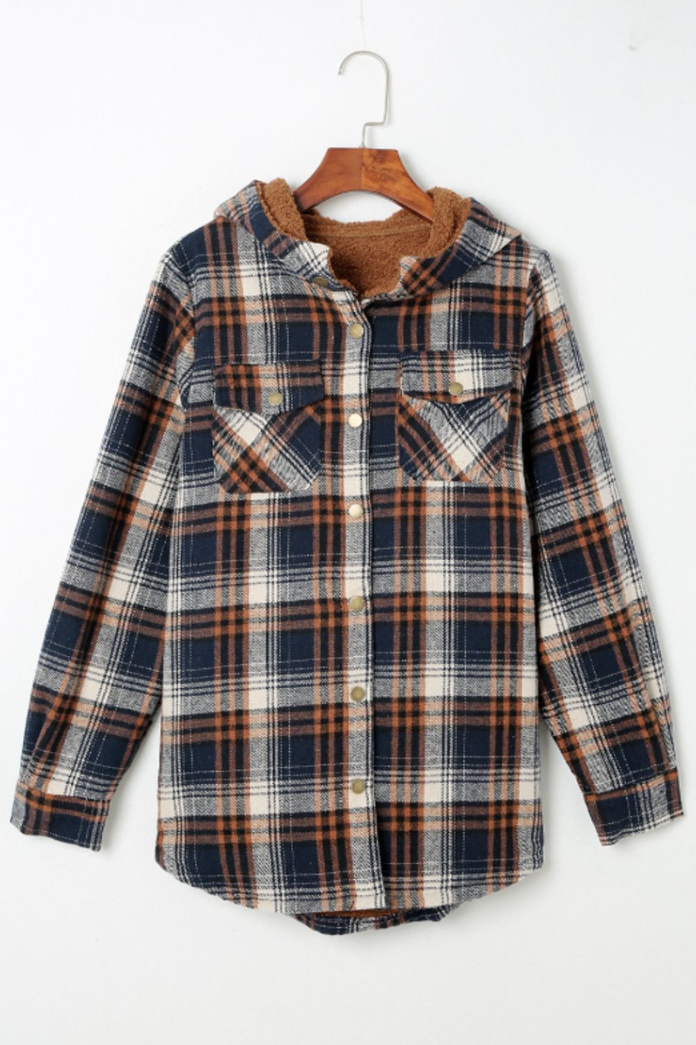 Multicolor plaid button-up shacket with sherpa-lined hood, worn open over a cream sweater