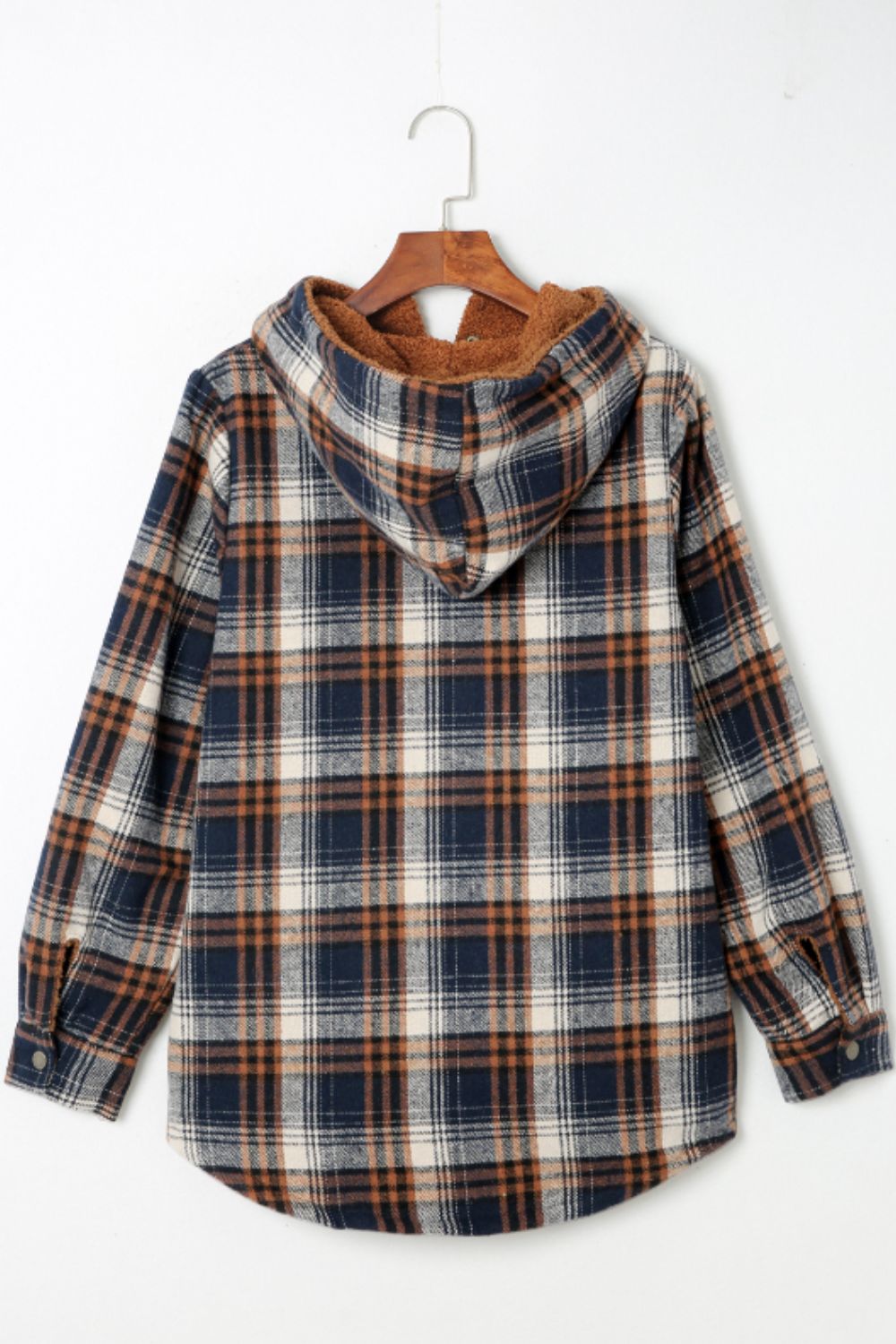 Multicolor plaid button-up shacket with sherpa-lined hood, worn open over a cream sweater