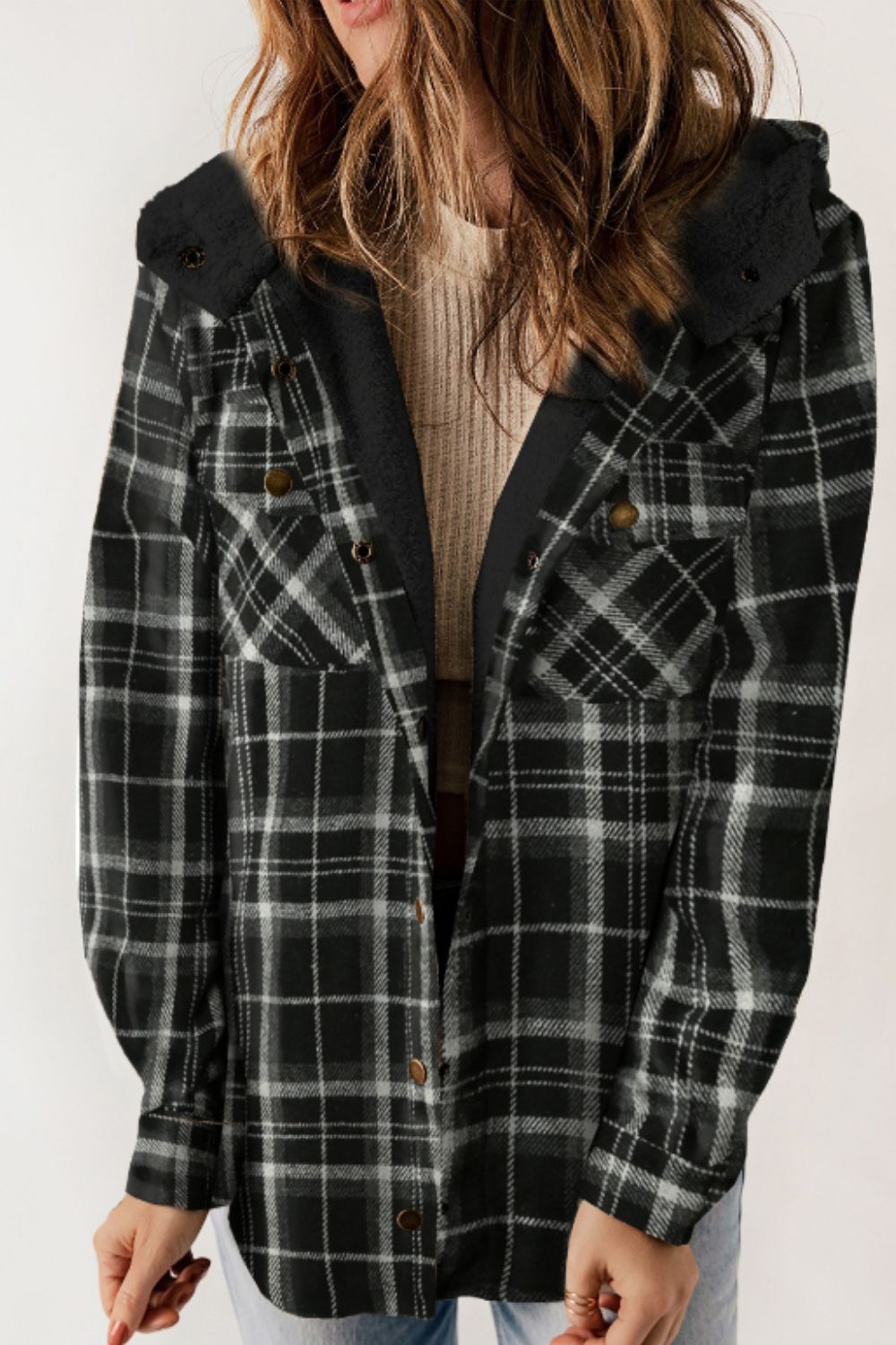 Multicolor plaid button-up shacket with sherpa-lined hood, worn open over a cream sweater