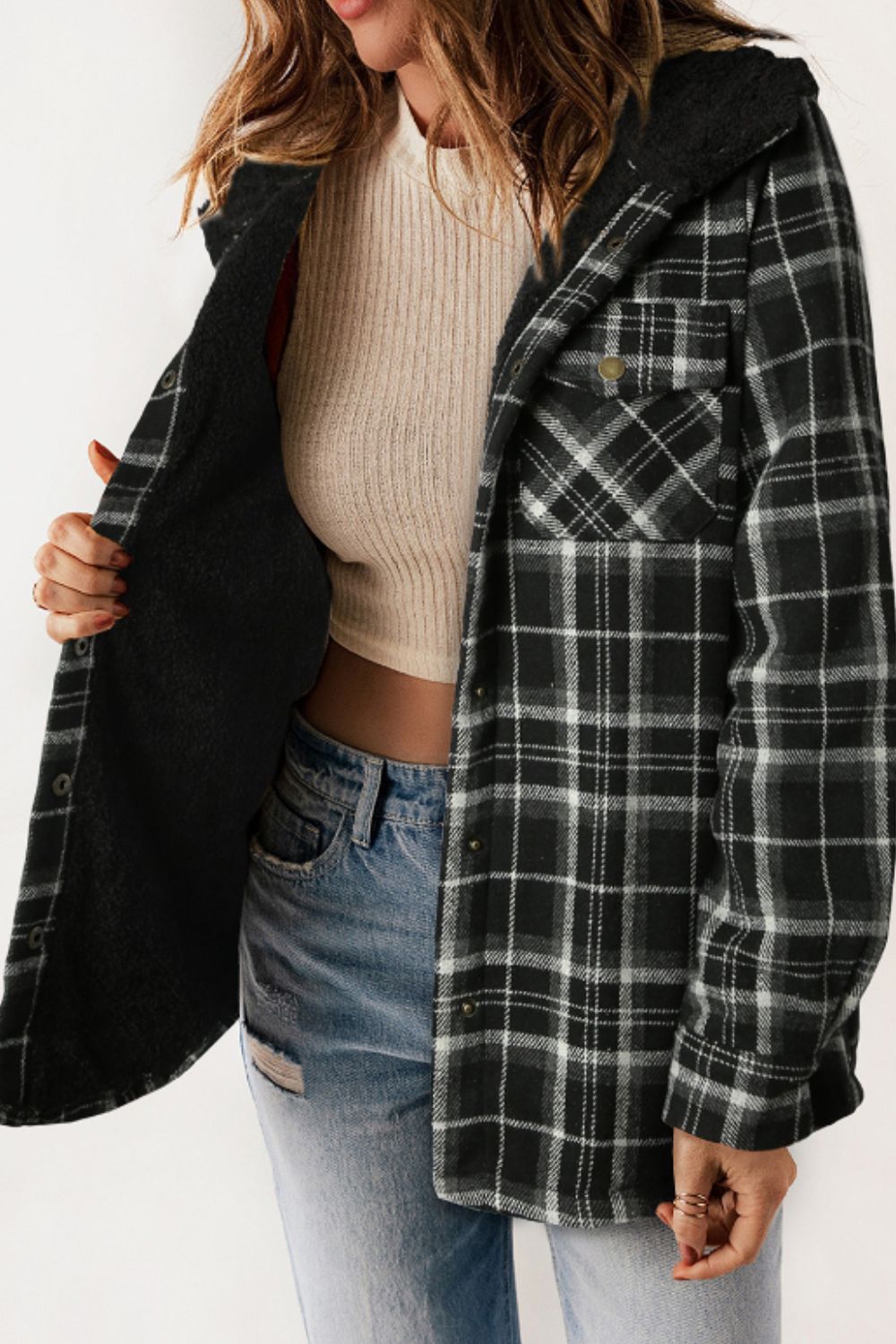 Multicolor plaid button-up shacket with sherpa-lined hood, worn open over a cream sweater