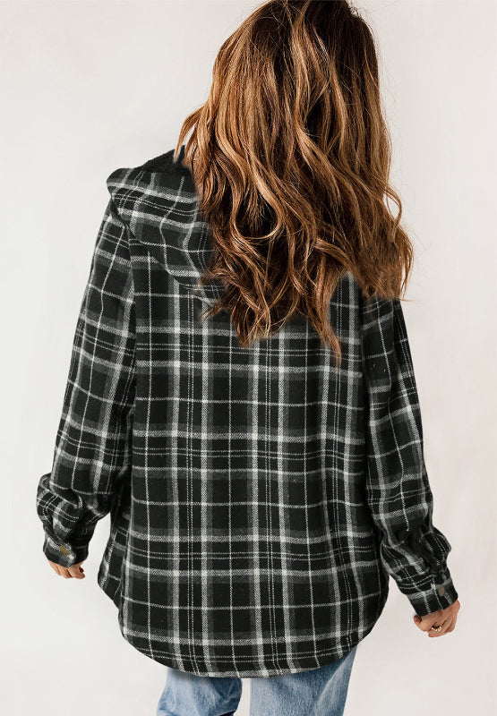 Multicolor plaid button-up shacket with sherpa-lined hood, worn open over a cream sweater