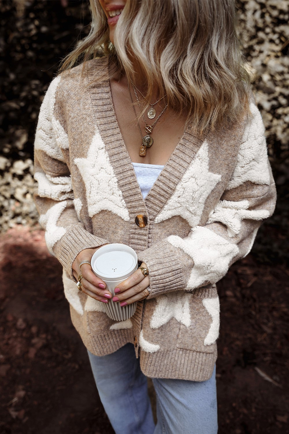 Mocha cardigan with cream star pattern and button-up front, long sleeves