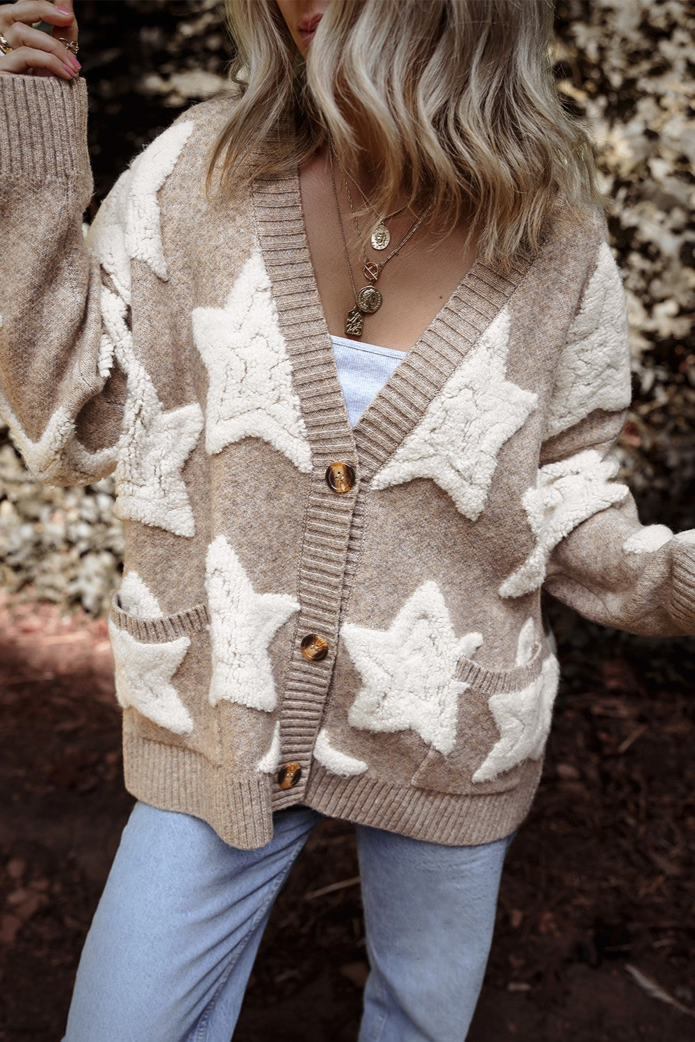 Mocha cardigan with cream star pattern and button-up front, long sleeves