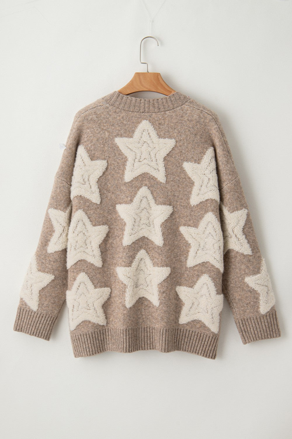 Mocha cardigan with cream star pattern and button-up front, long sleeves