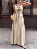 V-neck sleeveless maxi dress in tan, front view