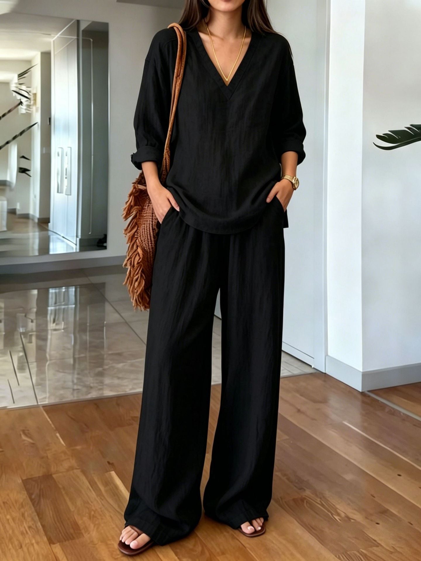 Black v-neck top and wide-leg pants set - front view