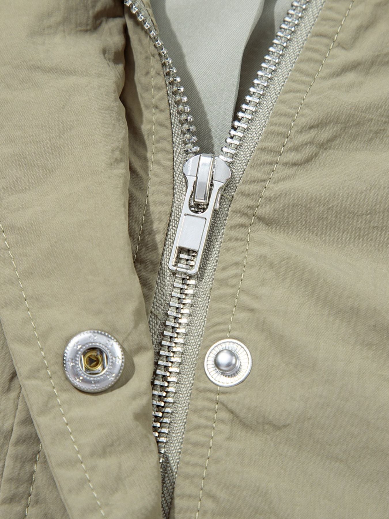 Yellow-green cropped utility jacket with hood, worn open over a tank top